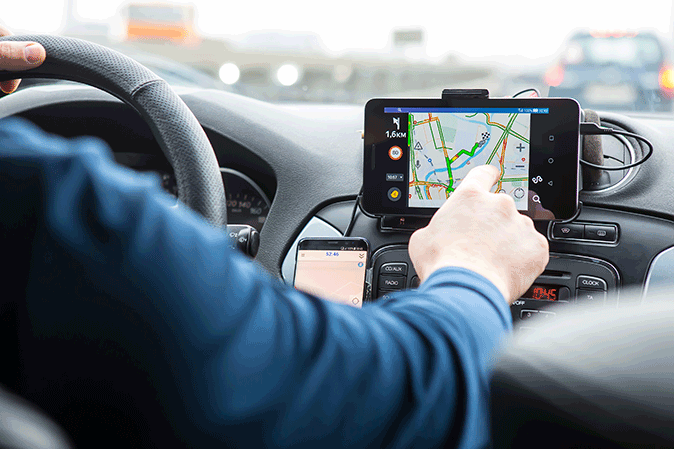 Man using directions on his car navigation system