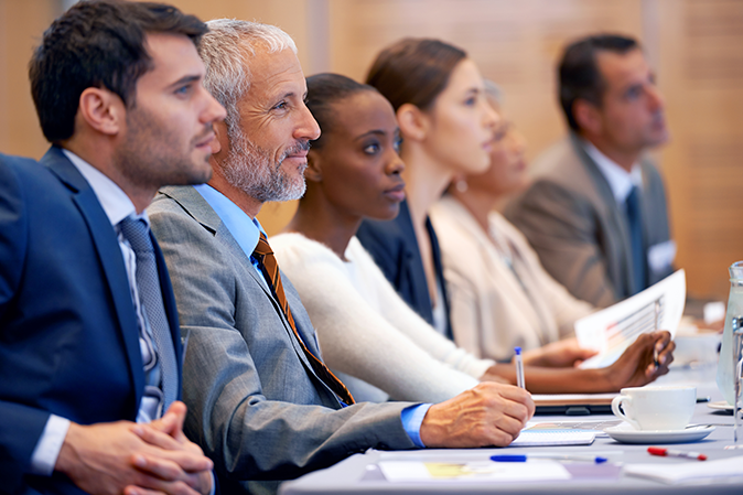 Group of professionals attending an in-person conference