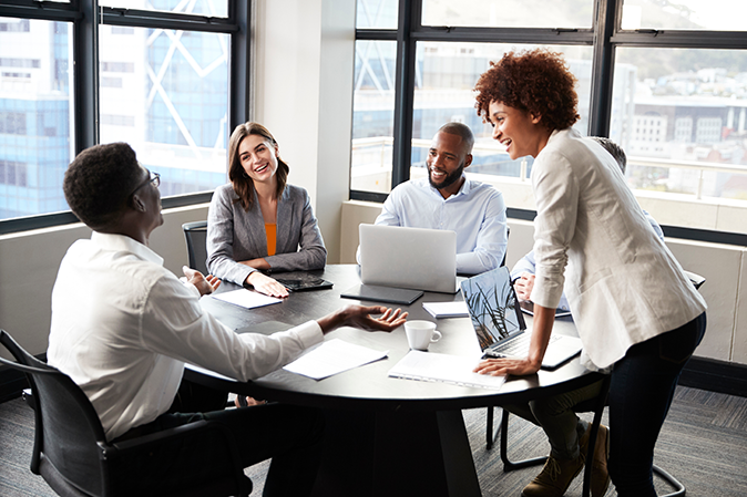 Group of professionals meeting around a table in an office
