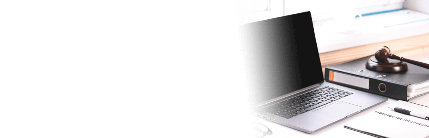 Jurisprudence courses. On the table there is a computer and a folder with business papers. Online learning